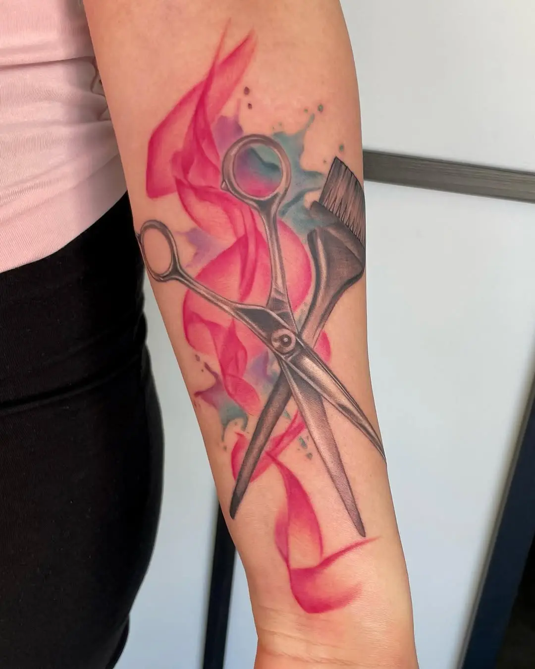 Vibrant tattoo of shears and brush design