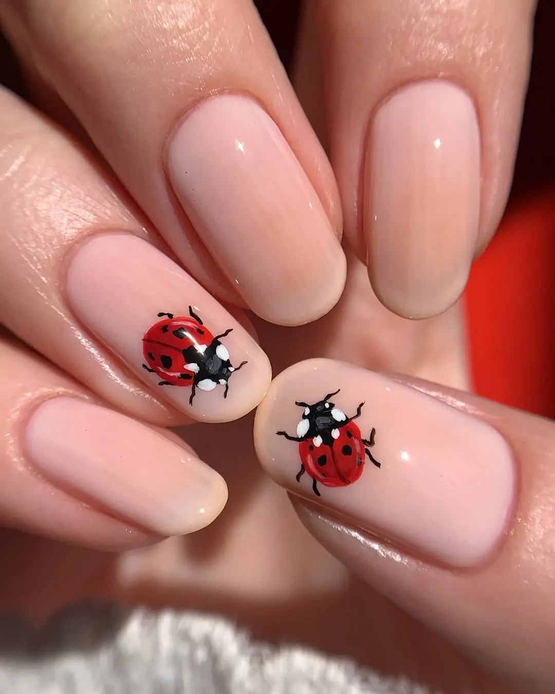 Charming ladybug nail art for a playful look