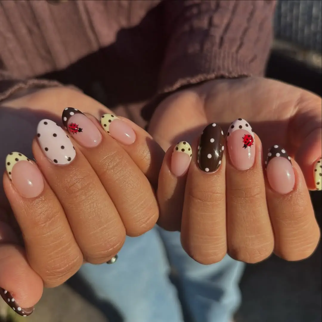 Charming ladybug-themed nail art design