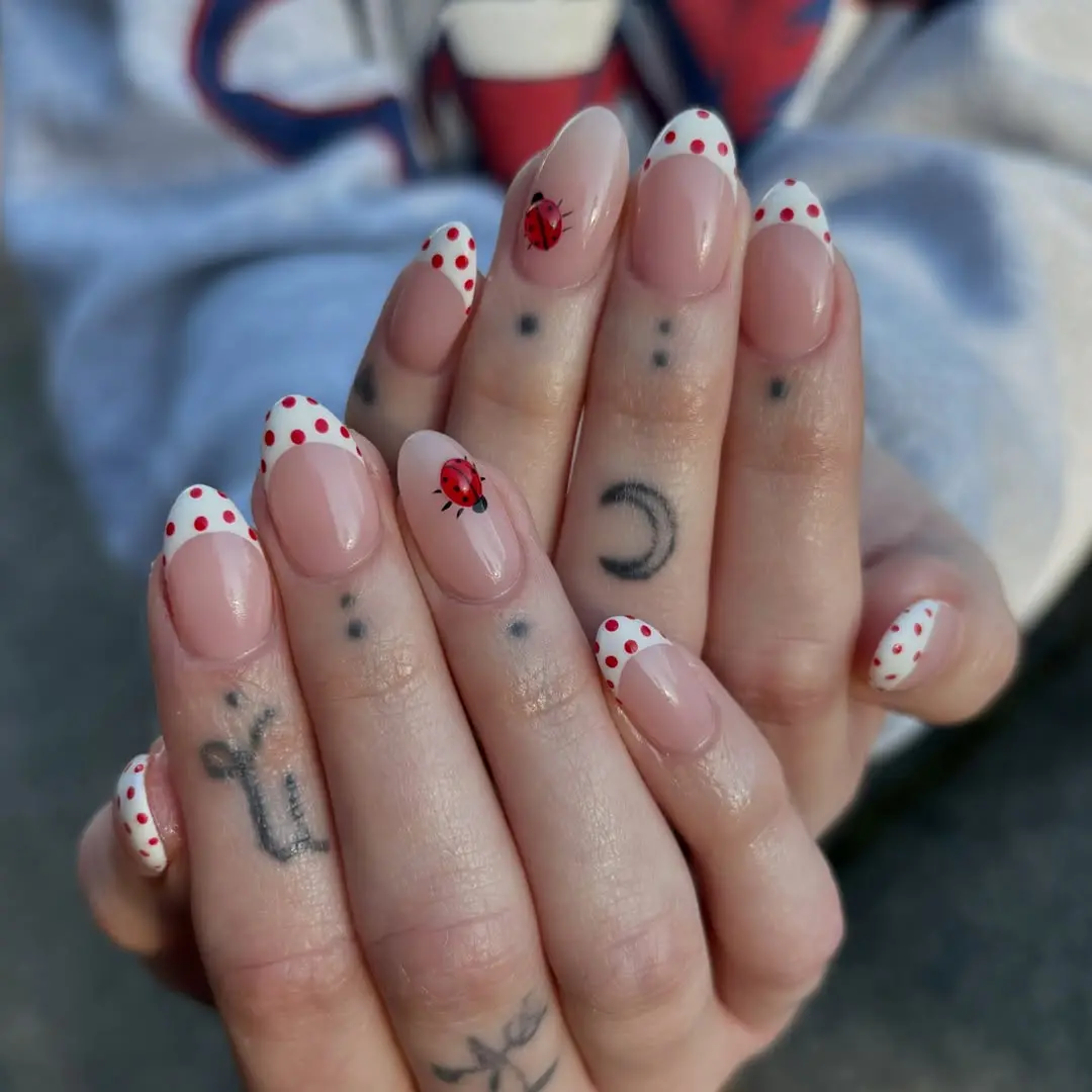 Charming ladybug nails with polka dot tips