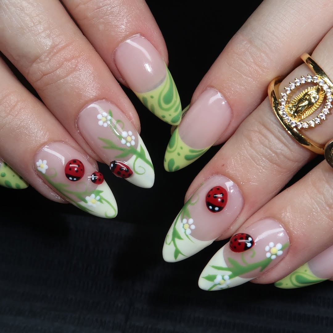 Charming ladybug nails with floral accents