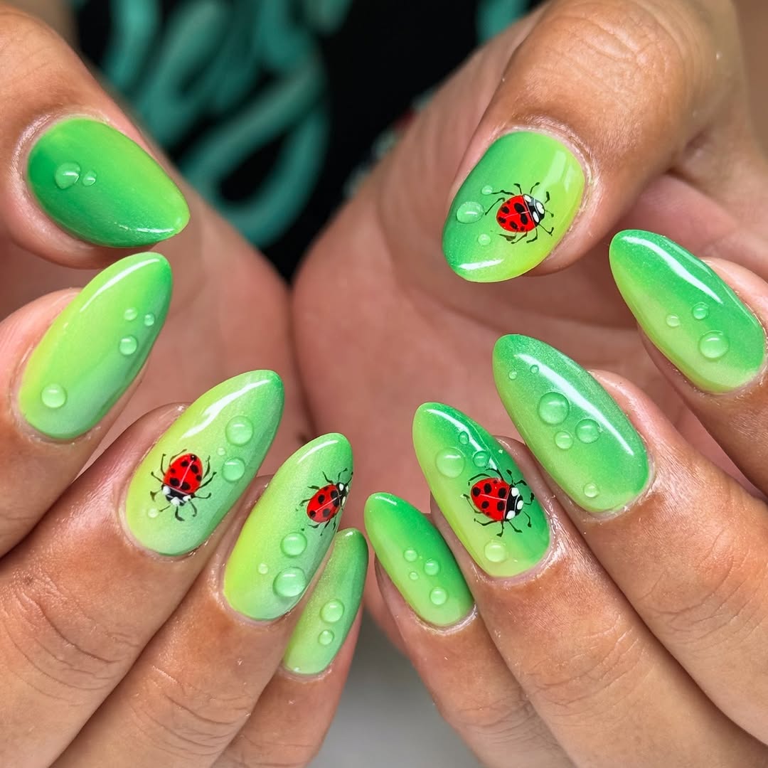 Vibrant Ladybug Nail Art with Green Ombre