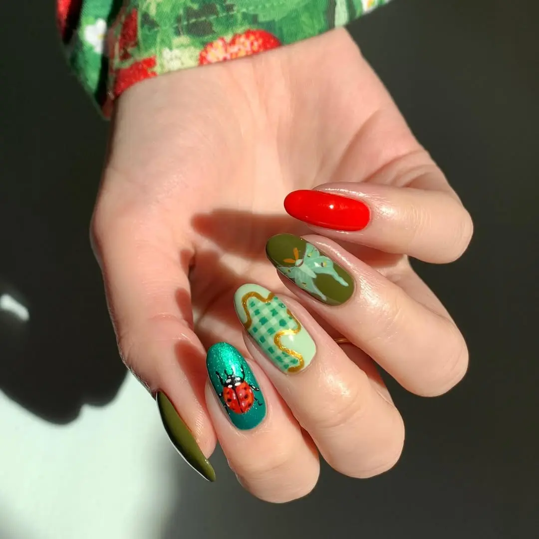 Vibrant ladybug nails in playful color scheme