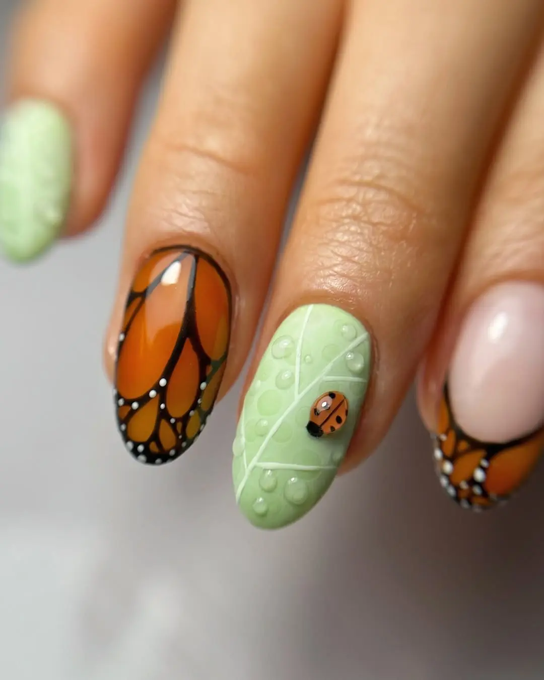 Charming ladybug nails with butterfly accents
