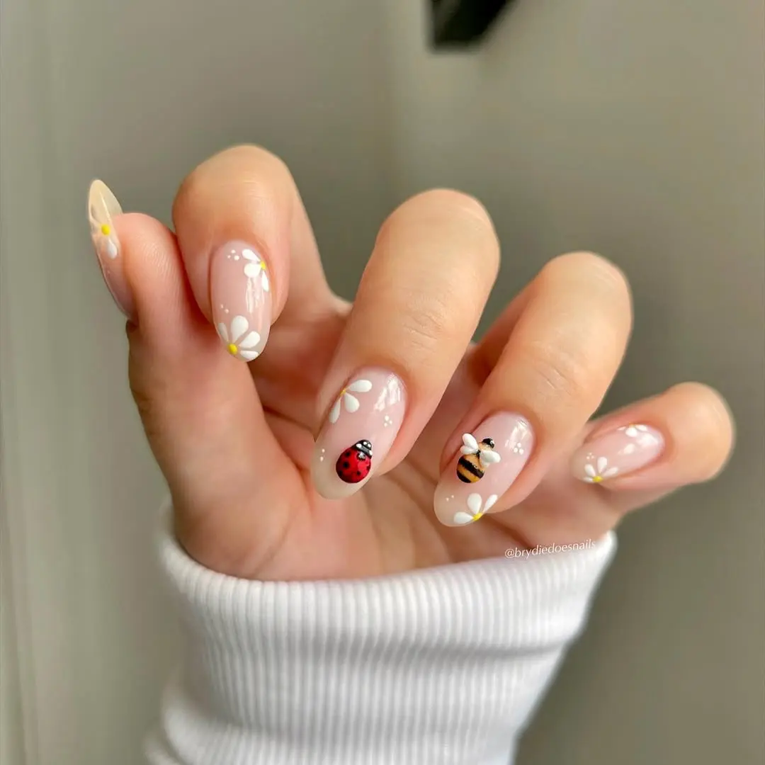 Charming ladybug-themed spring nail art inspiration