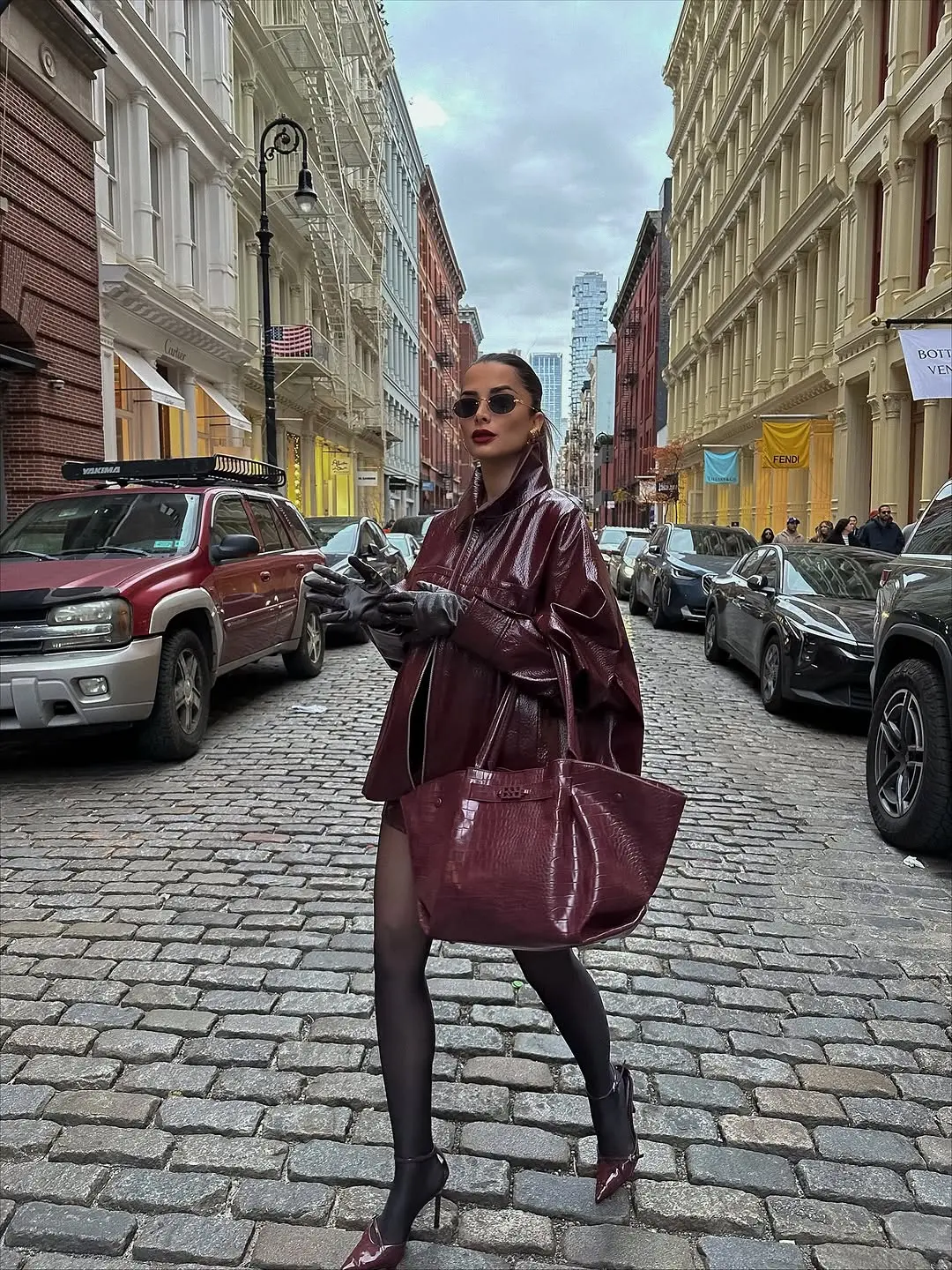 Chic monochrome look with burgundy accents