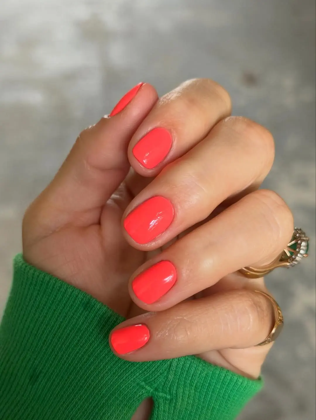 Stylish vibrant coral neon nails for summer