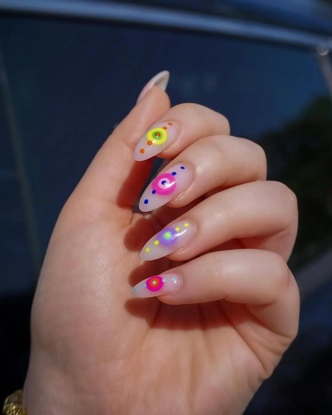 Vibrant neon nail art with playful patterns