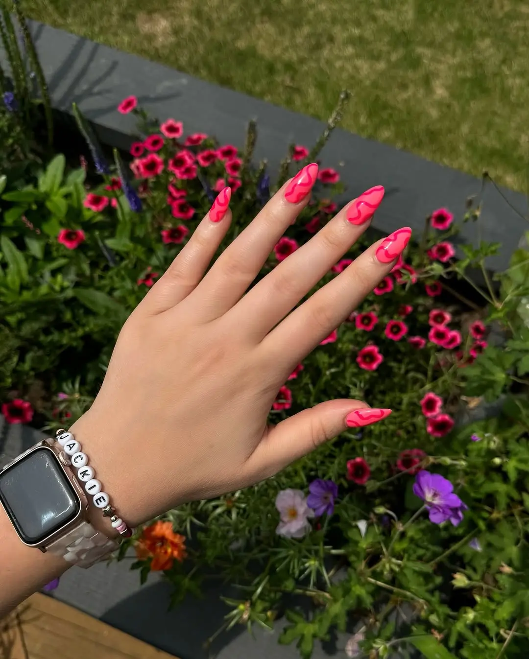 Vibrant neon nails with trendy flame design