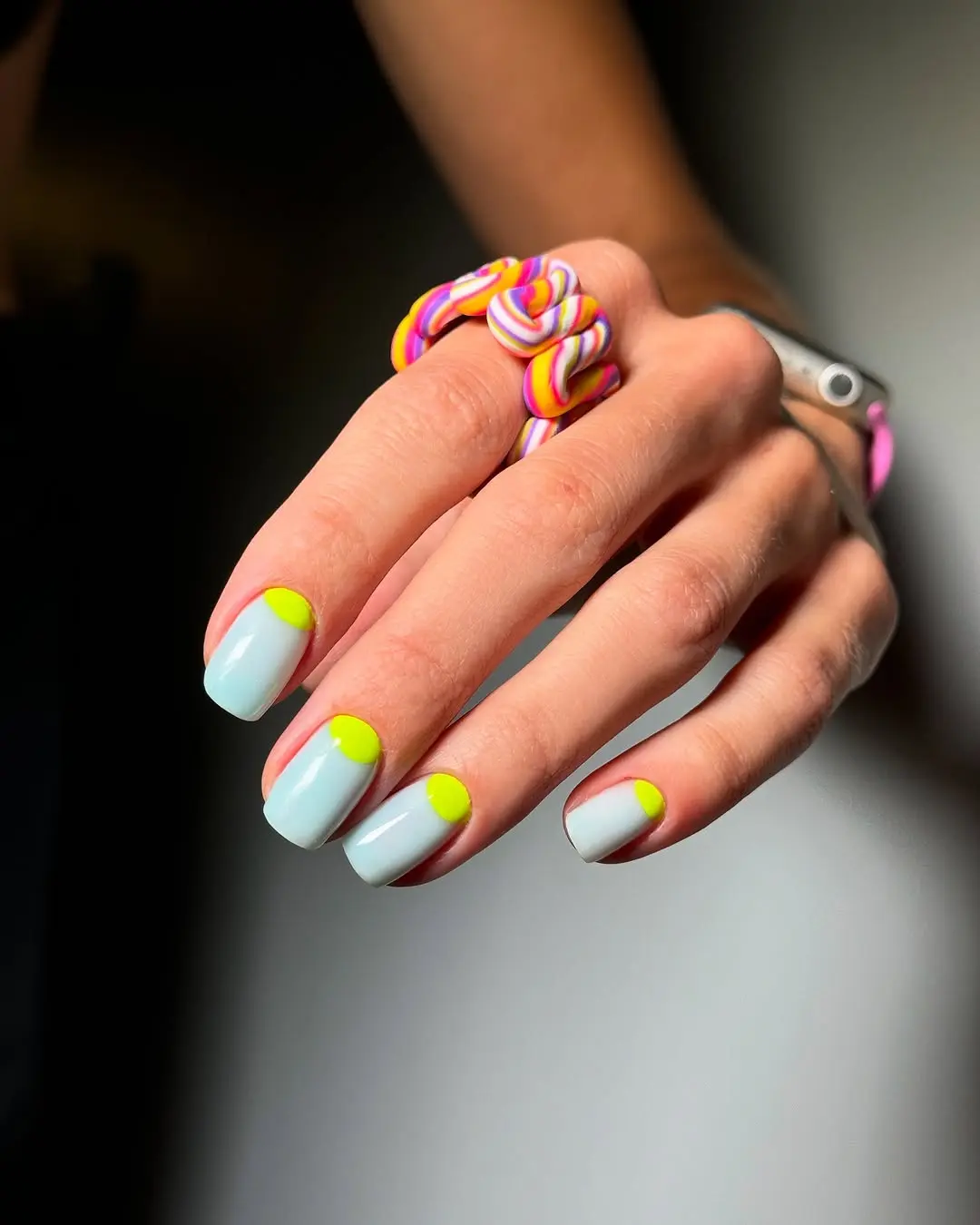 Vibrant Neon Accents on Soft Blue Base