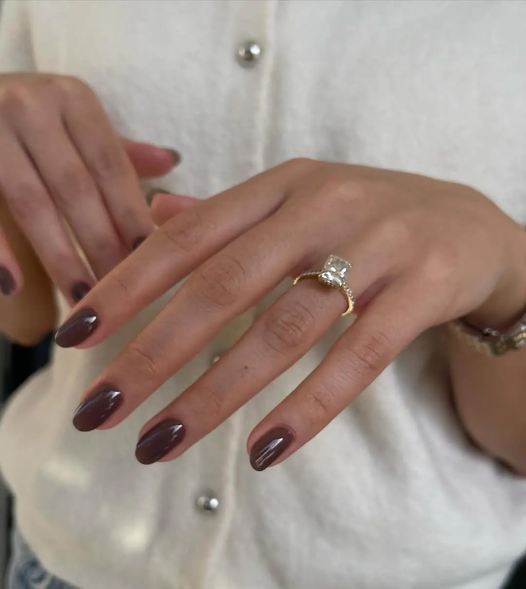 Sophisticated dark purple nails with elegant touch