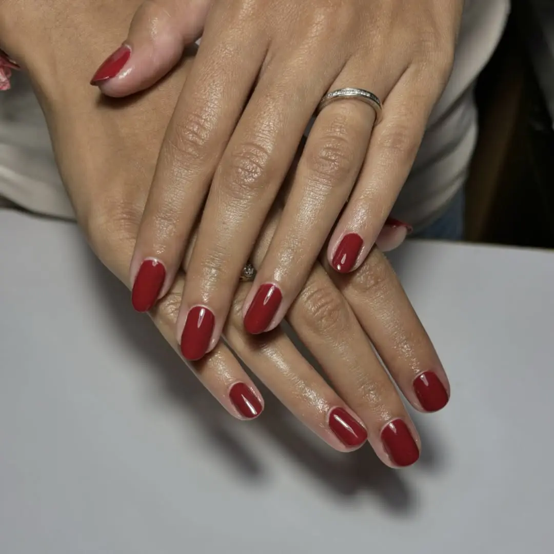Elegant deep red nails exuding sophistication.