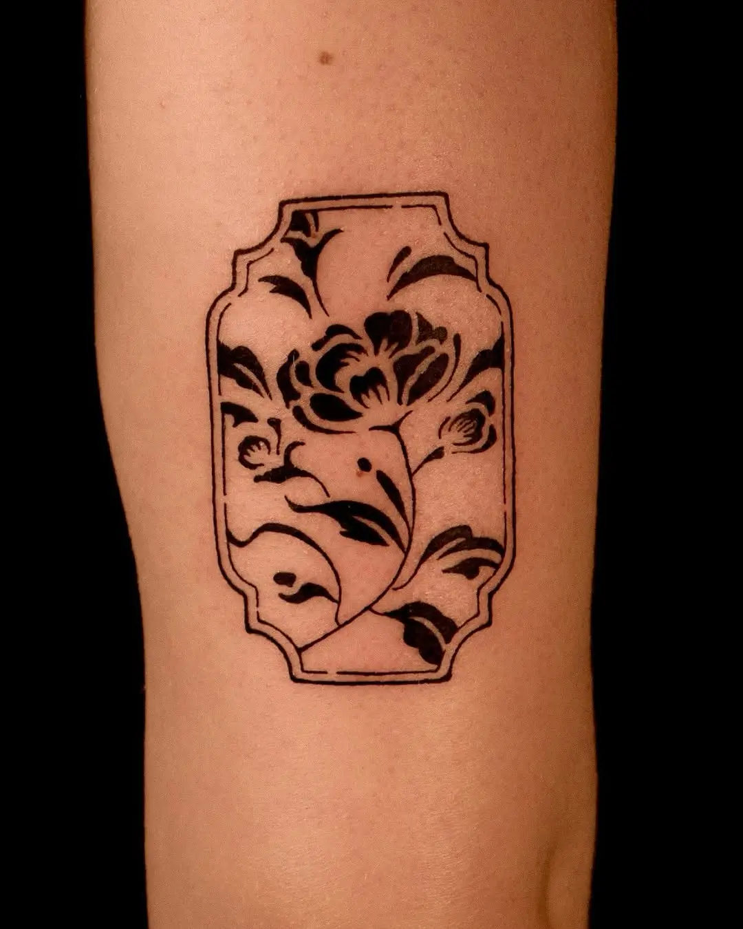 Stunning black ink peony tattoo design