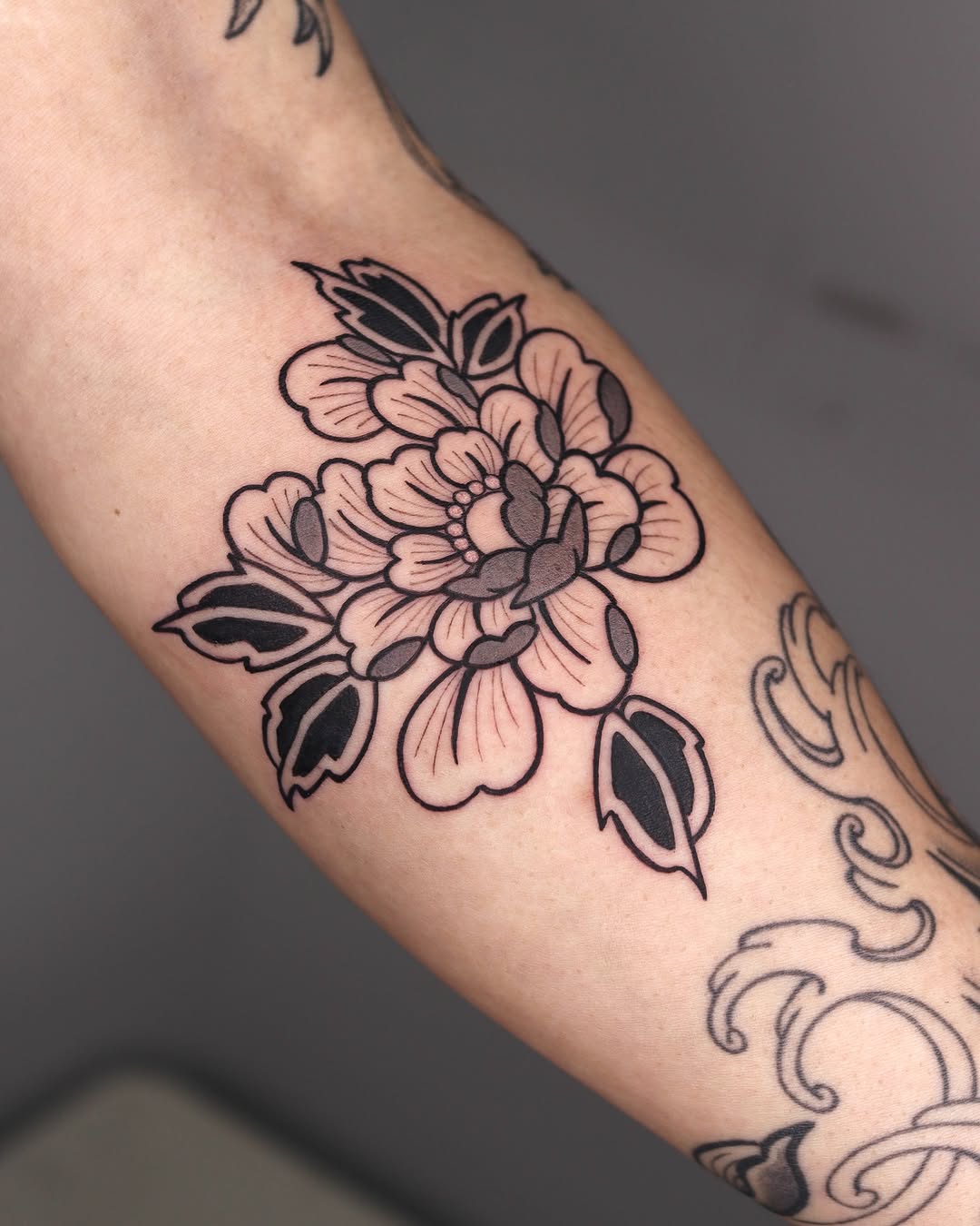 Stunning Peony Tattoo with Bold Lines