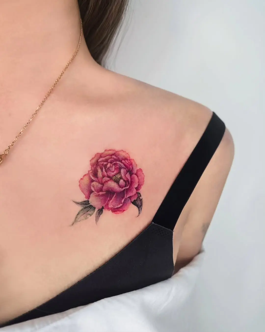 Elegant peony tattoo on shoulder