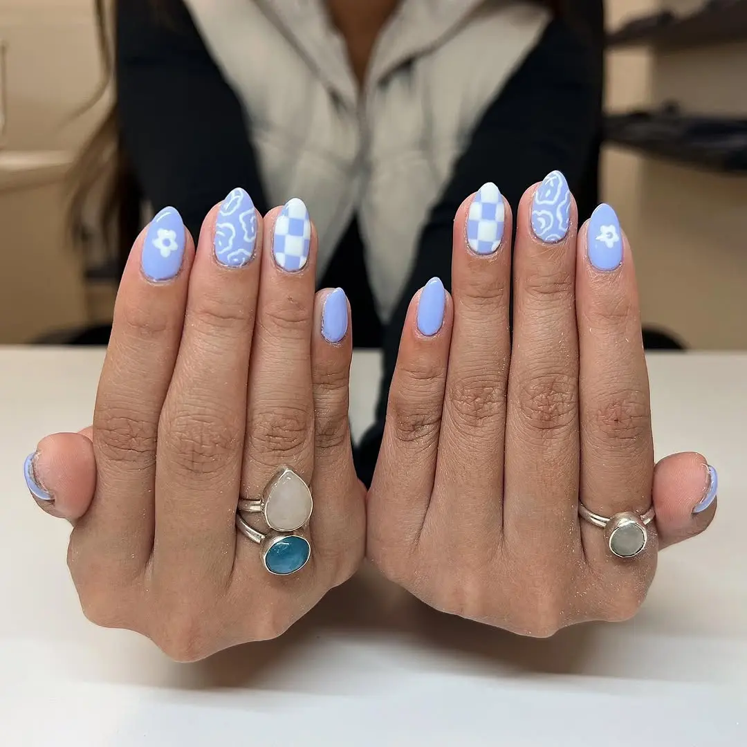 Charming periwinkle nails with playful designs