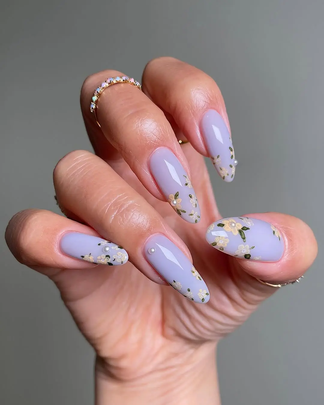 Elegant Periwinkle Nails with Delicate Flower Accents