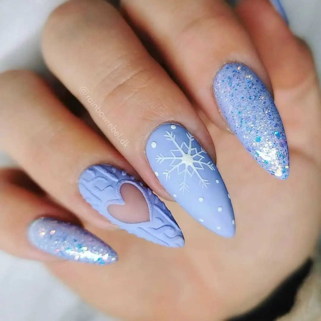 Stunning periwinkle nails with winter magic.