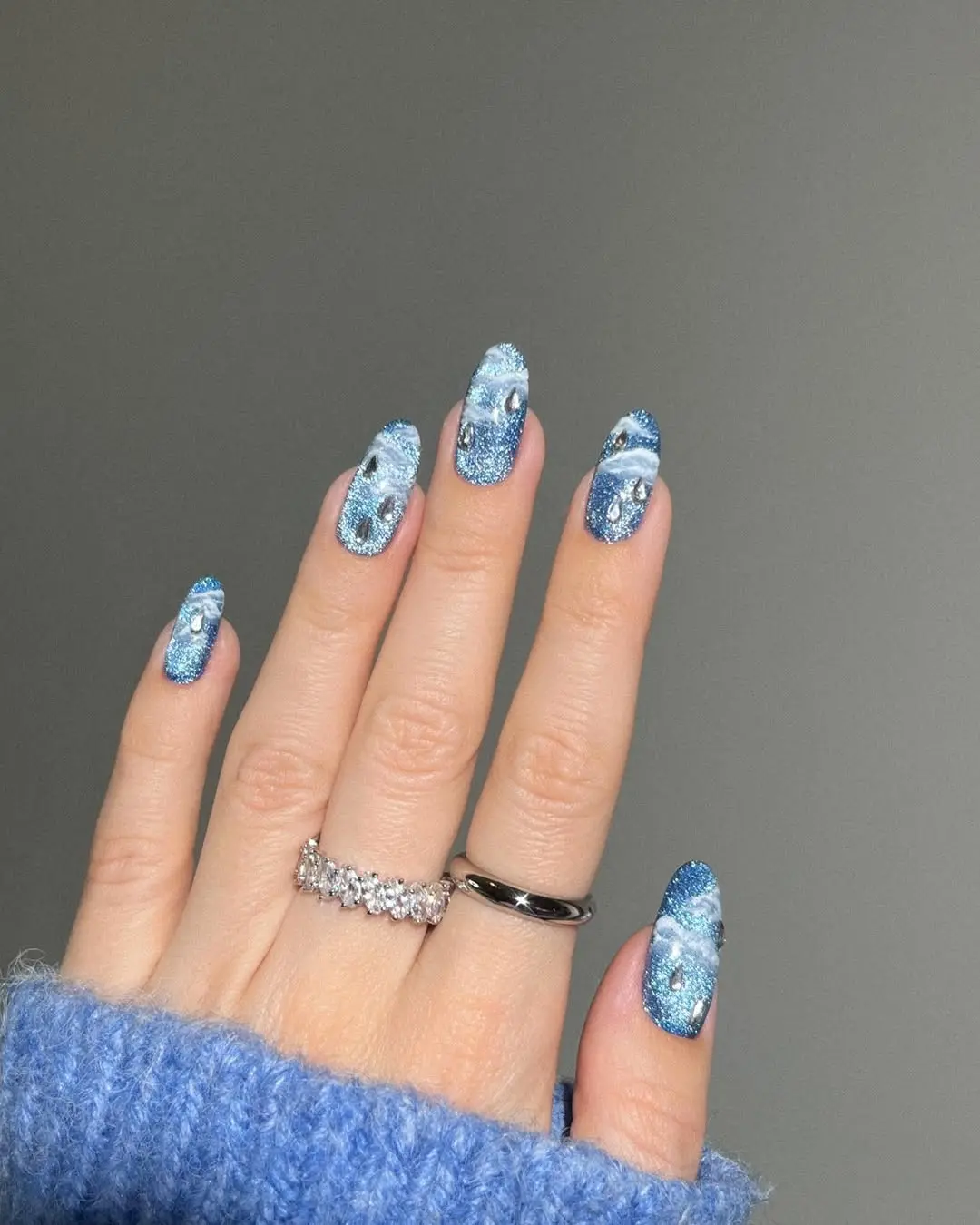Sparkling periwinkle nails with intricate designs