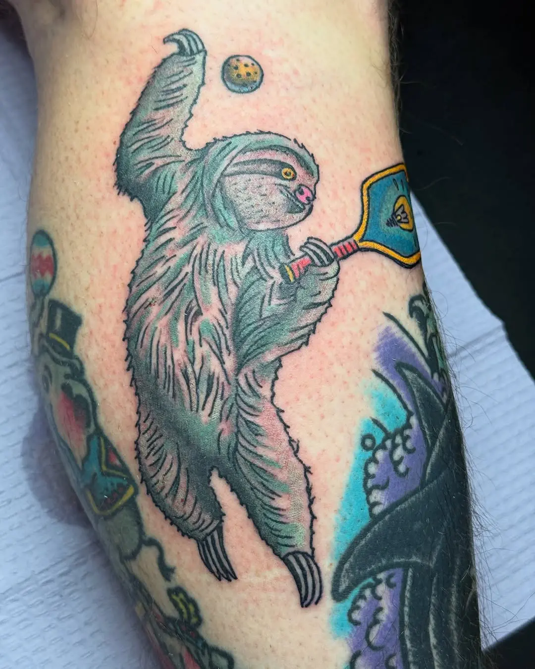 Unique sloth tattoo showcasing pickleball passion
