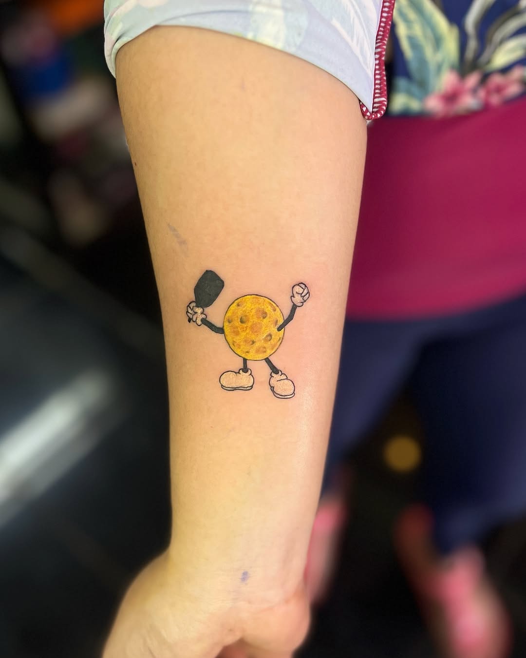 Whimsical pickleball cookie tattoo design.