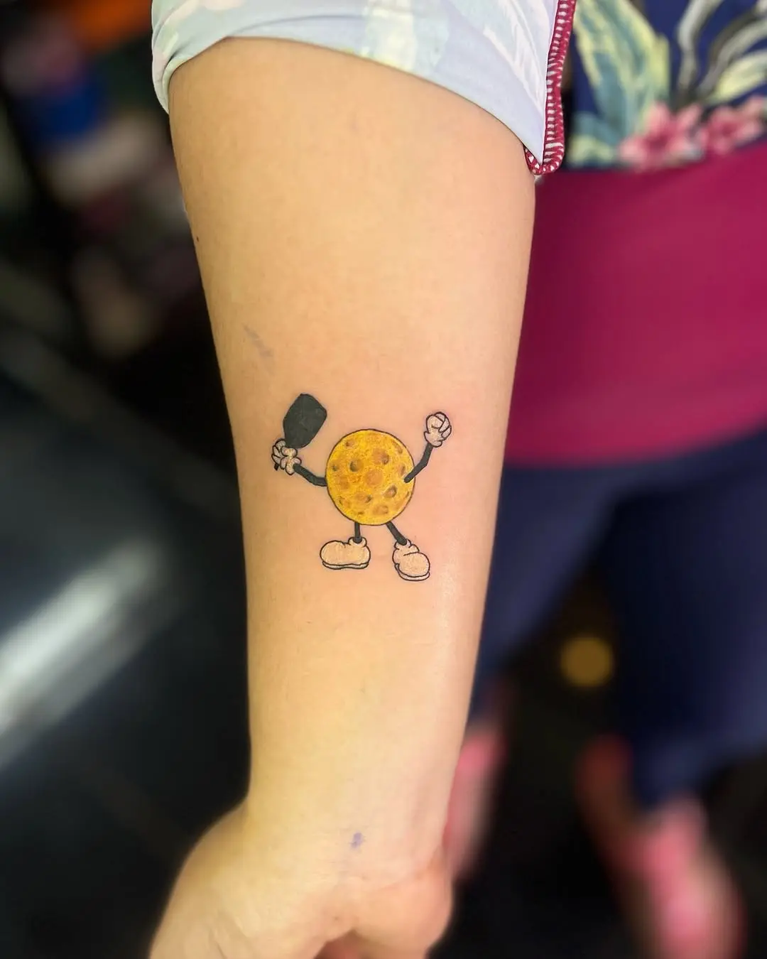 Whimsical pickleball cookie tattoo design.