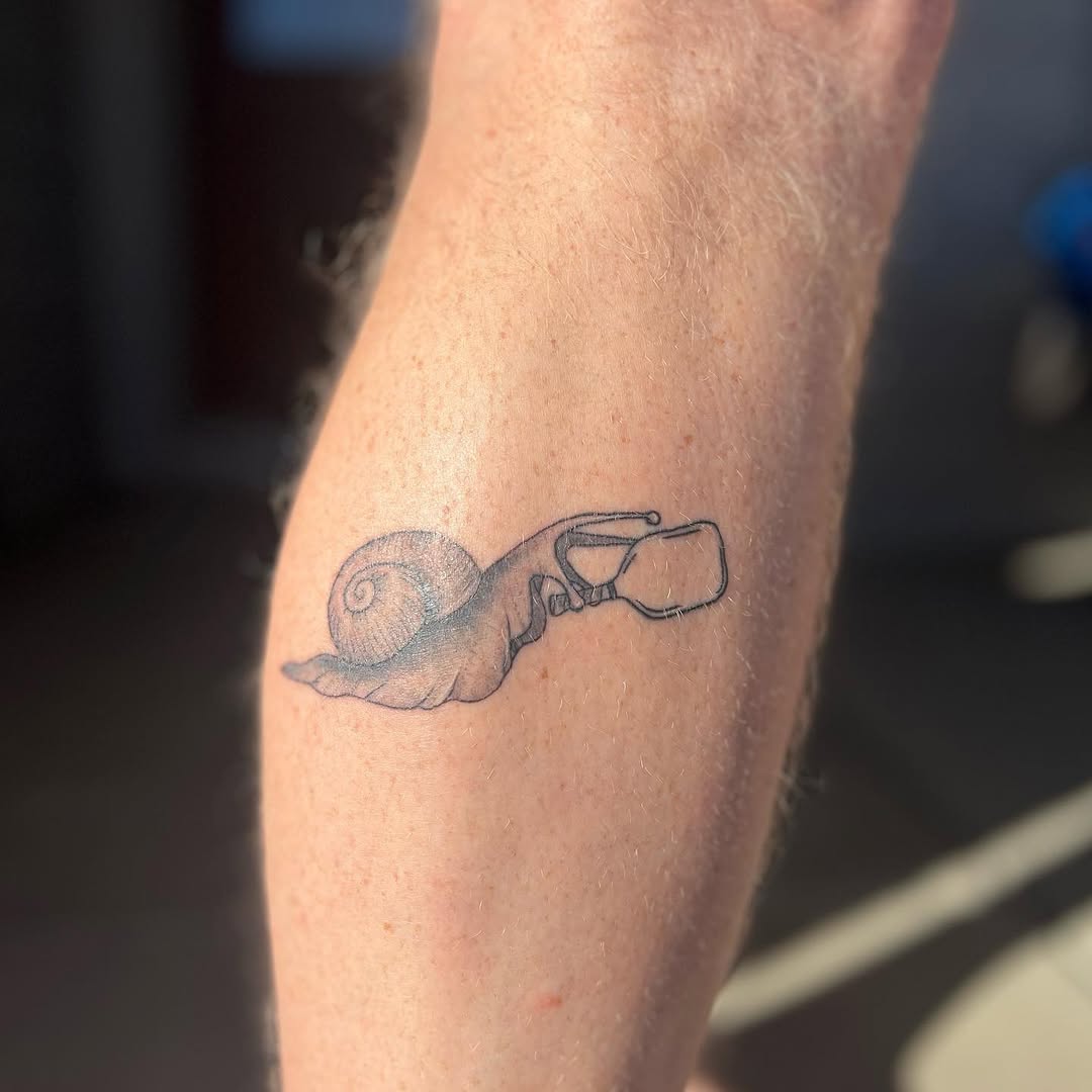 Unique Hand and Snail Pickleball Tattoo Design