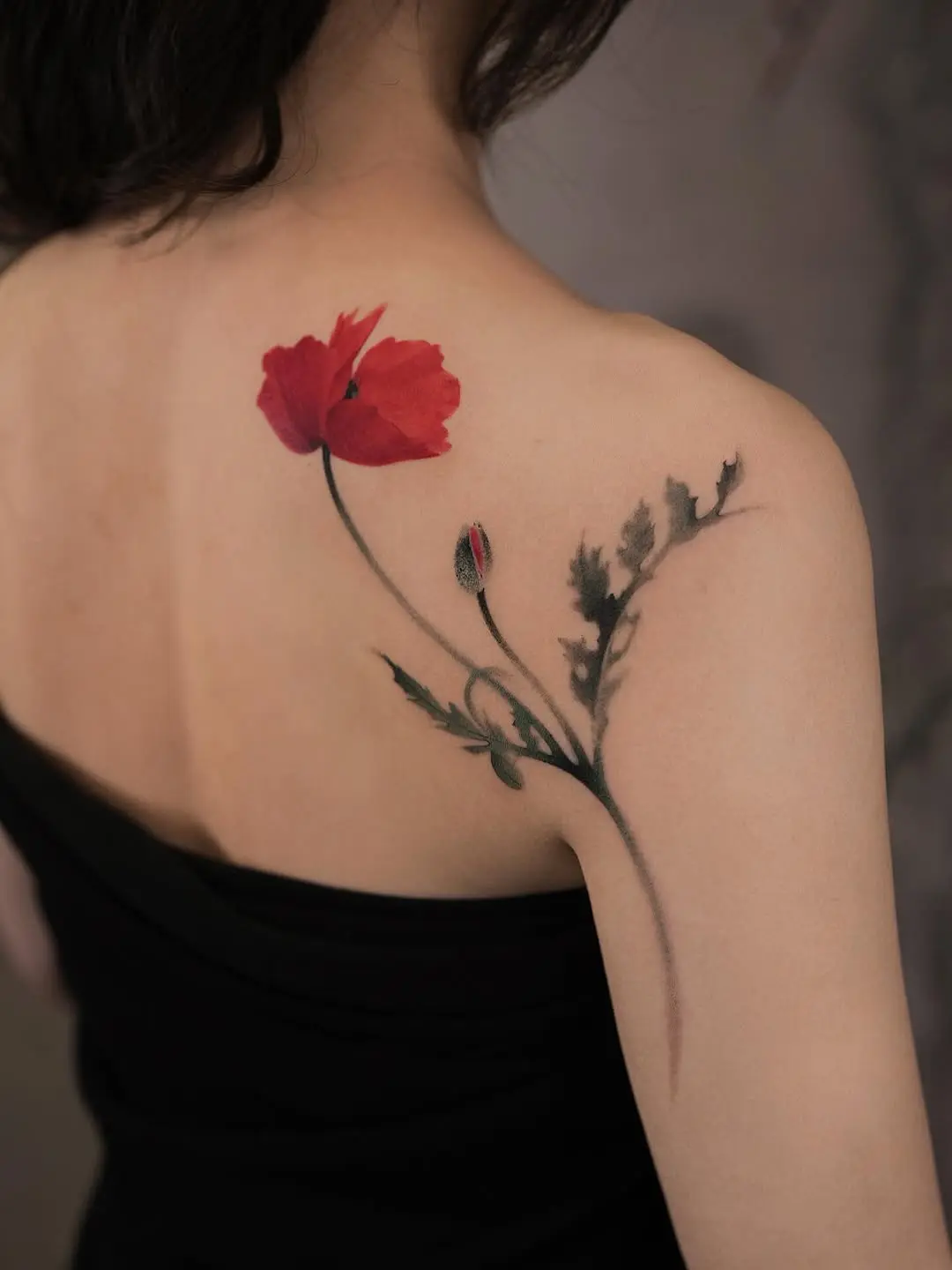 Elegant poppy tattoo on shoulder for beauty