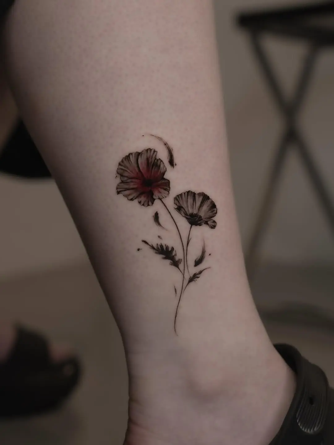 Elegant poppy tattoo with striking details