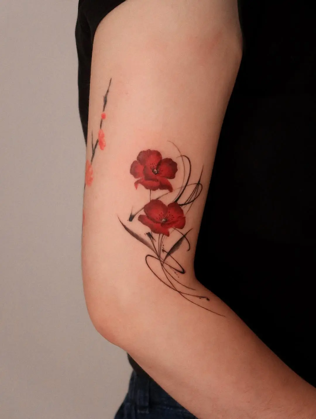 Bold Red Poppy Tattoo with Elegant Lines