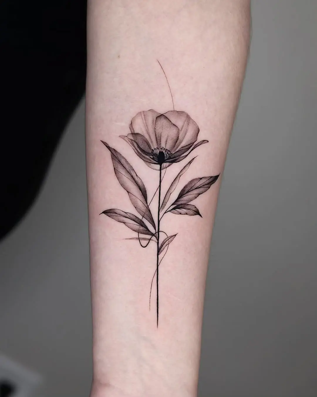 Elegant minimalist poppy tattoo design for arm