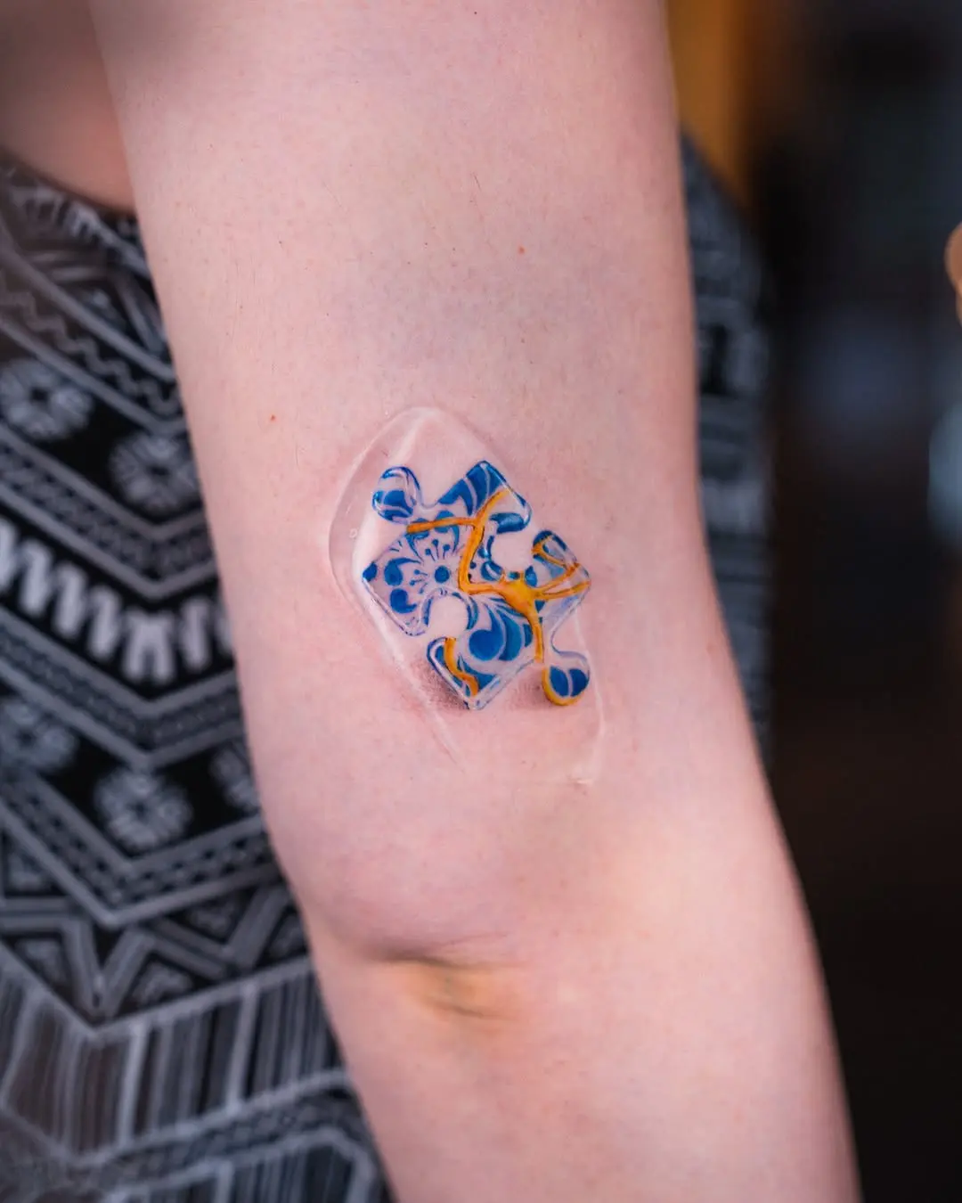 Vibrant puzzle tattoo with a fluid design