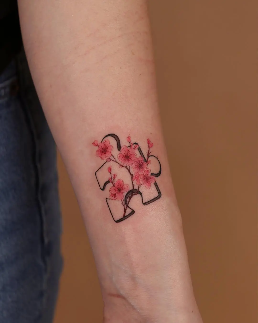 Floral puzzle piece tattoo with a unique twist