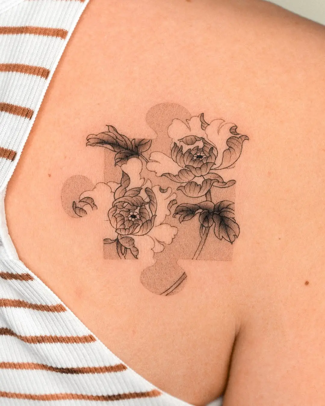 Intricate Floral Puzzle Piece Tattoo Design