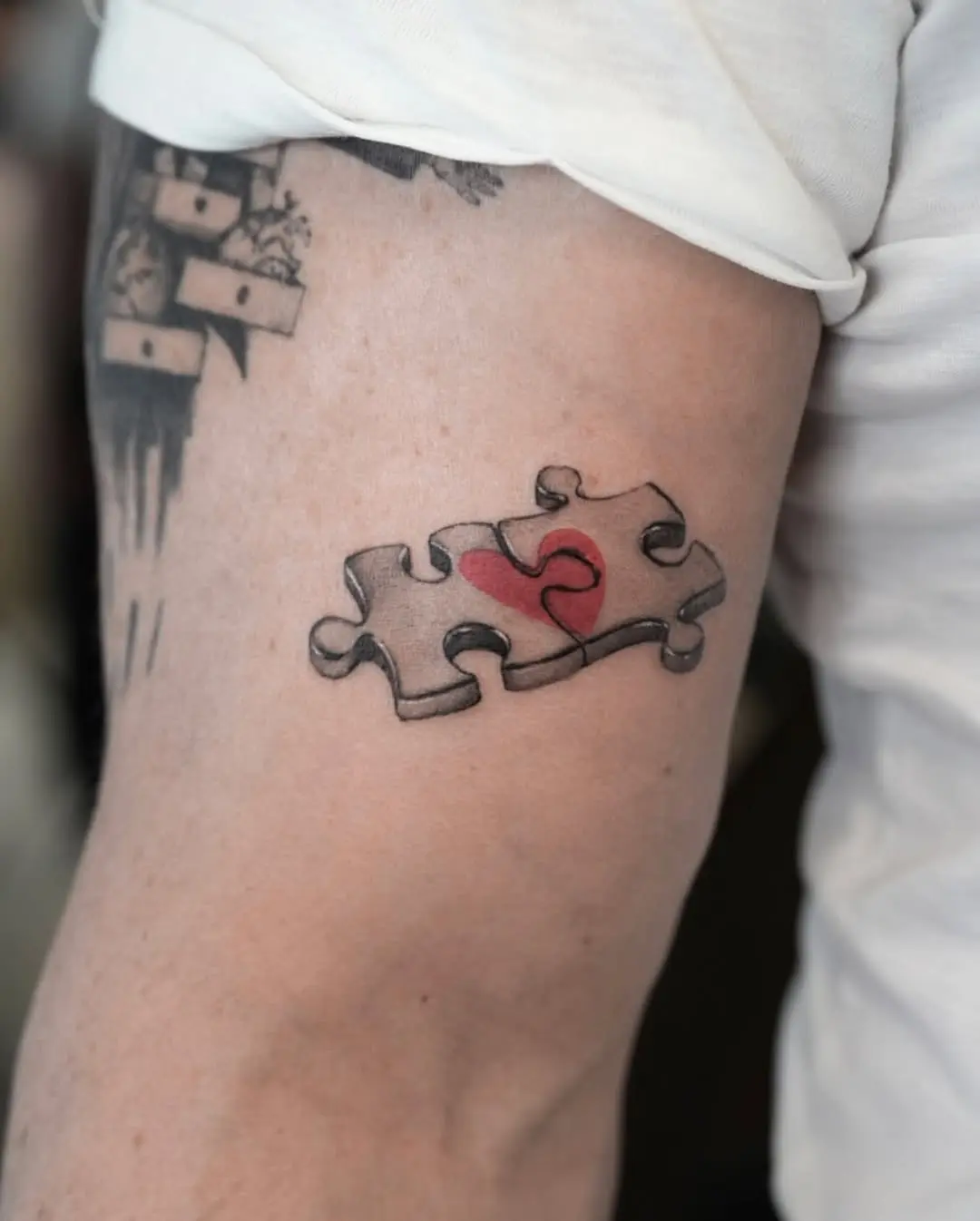 Heartfelt jigsaw tattoo with vibrant detail