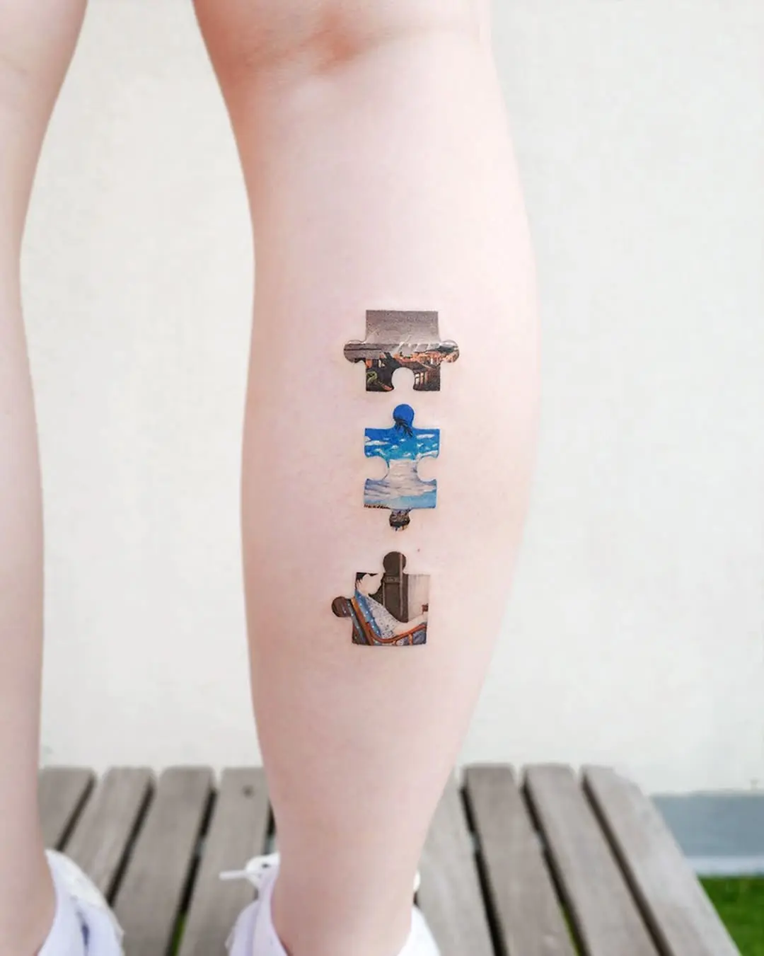 Artistic puzzle tattoo with vibrant imagery