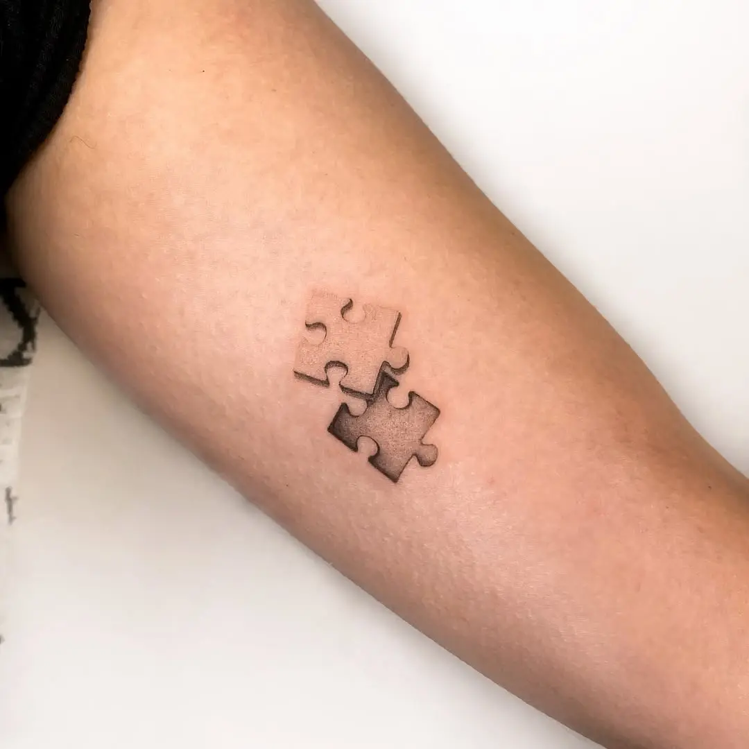 Stylish puzzle piece tattoo with shading