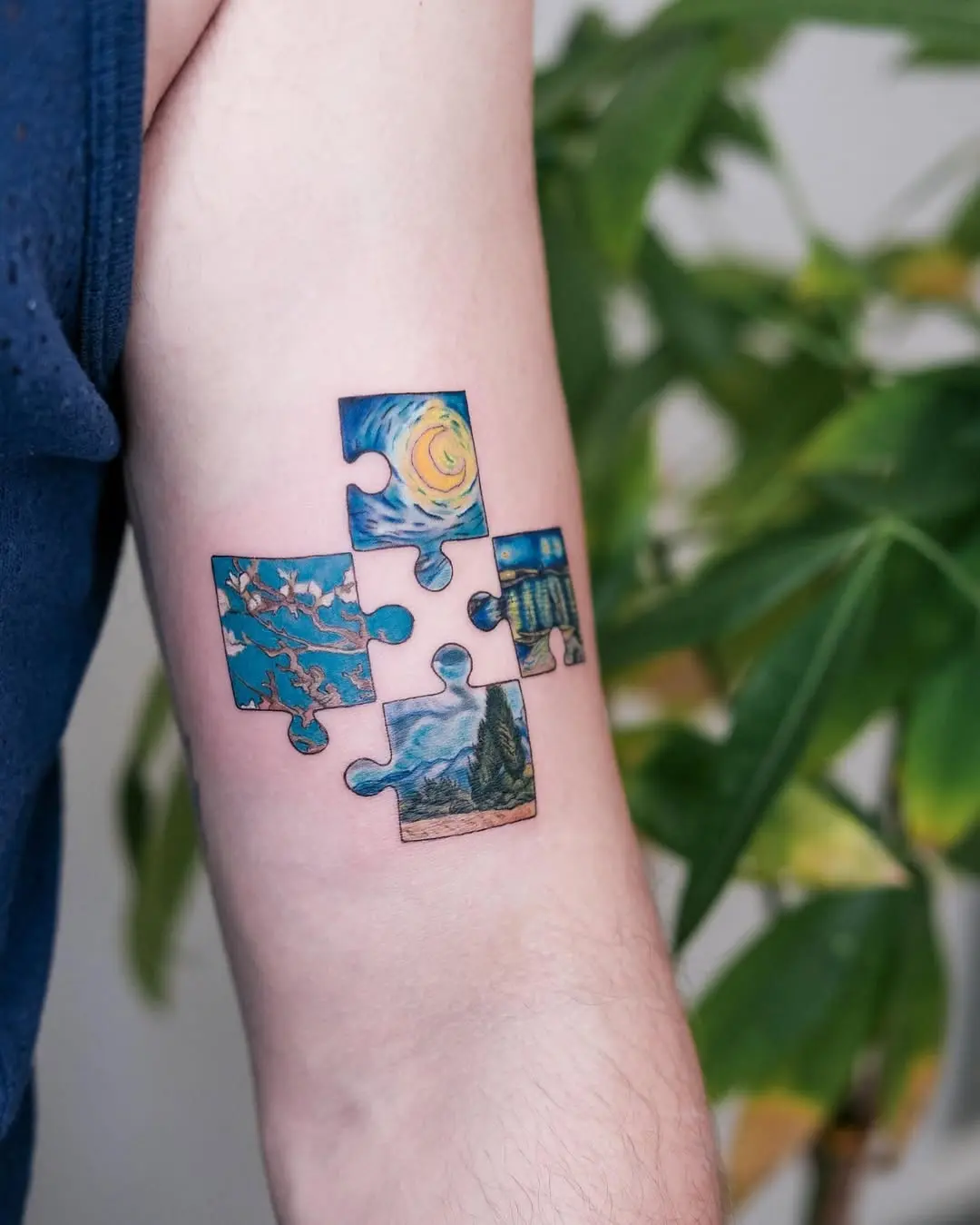 Artistic puzzle tattoo featuring Van Gogh scenes