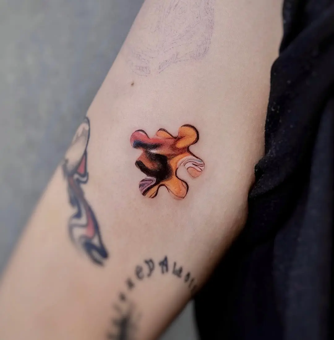 Stunning colorful puzzle piece tattoo design