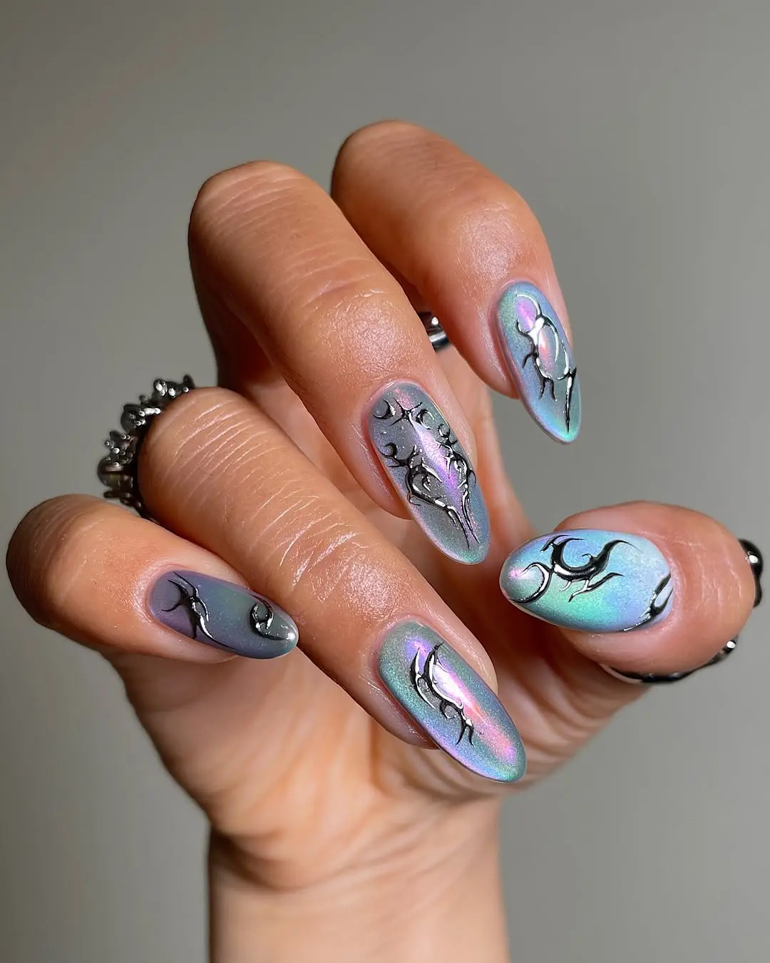 Holographic ribbed glass nails with artistic patterns