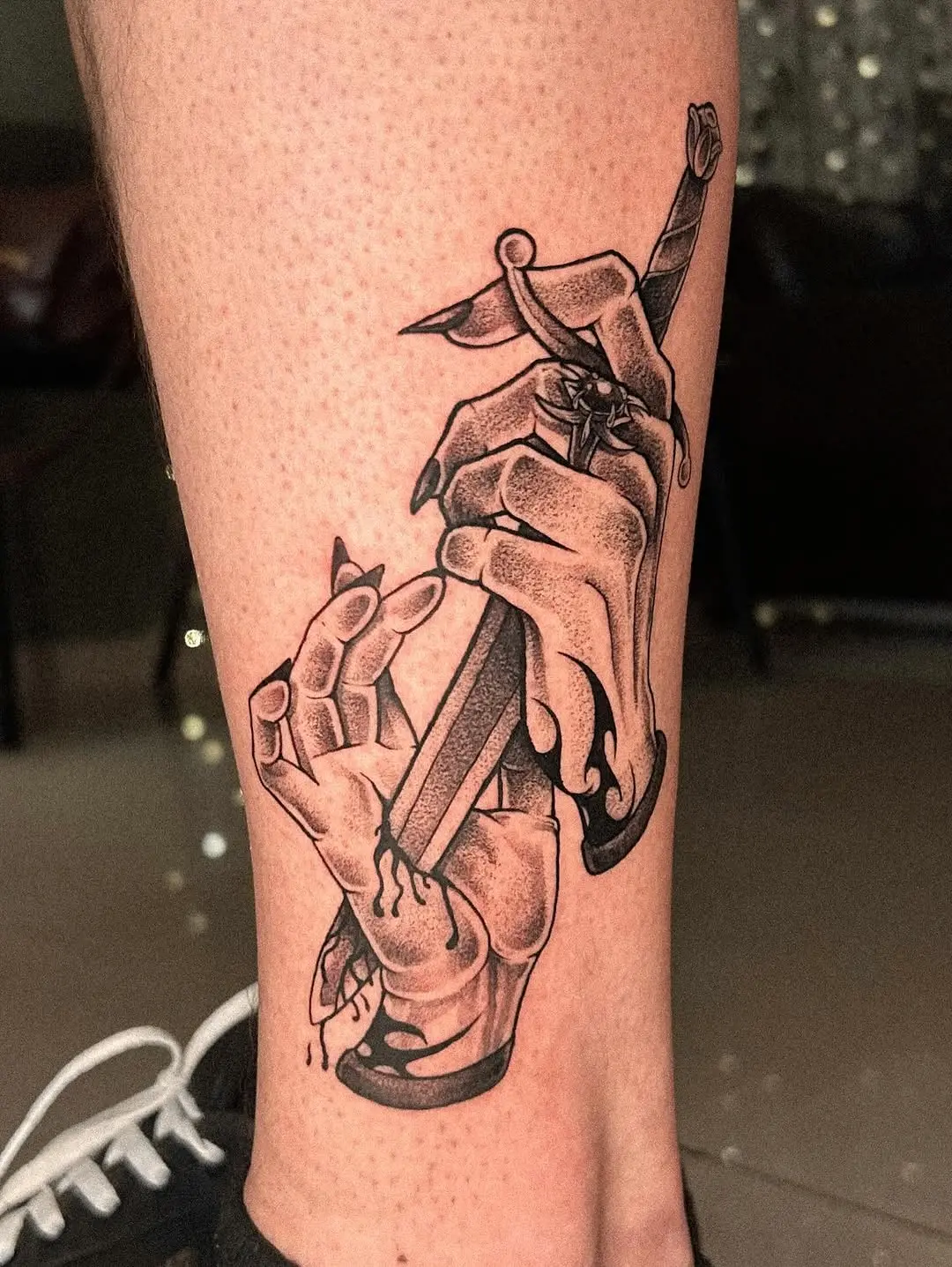 Powerful sacrificial tattoo with gripping hands