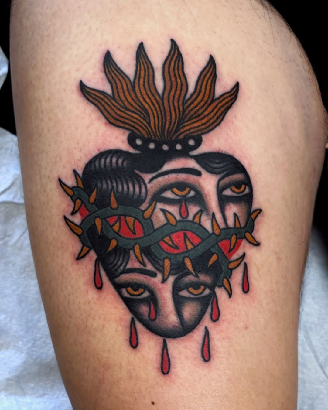 Unique Heart Tattoo with Dual Faces and Thorns