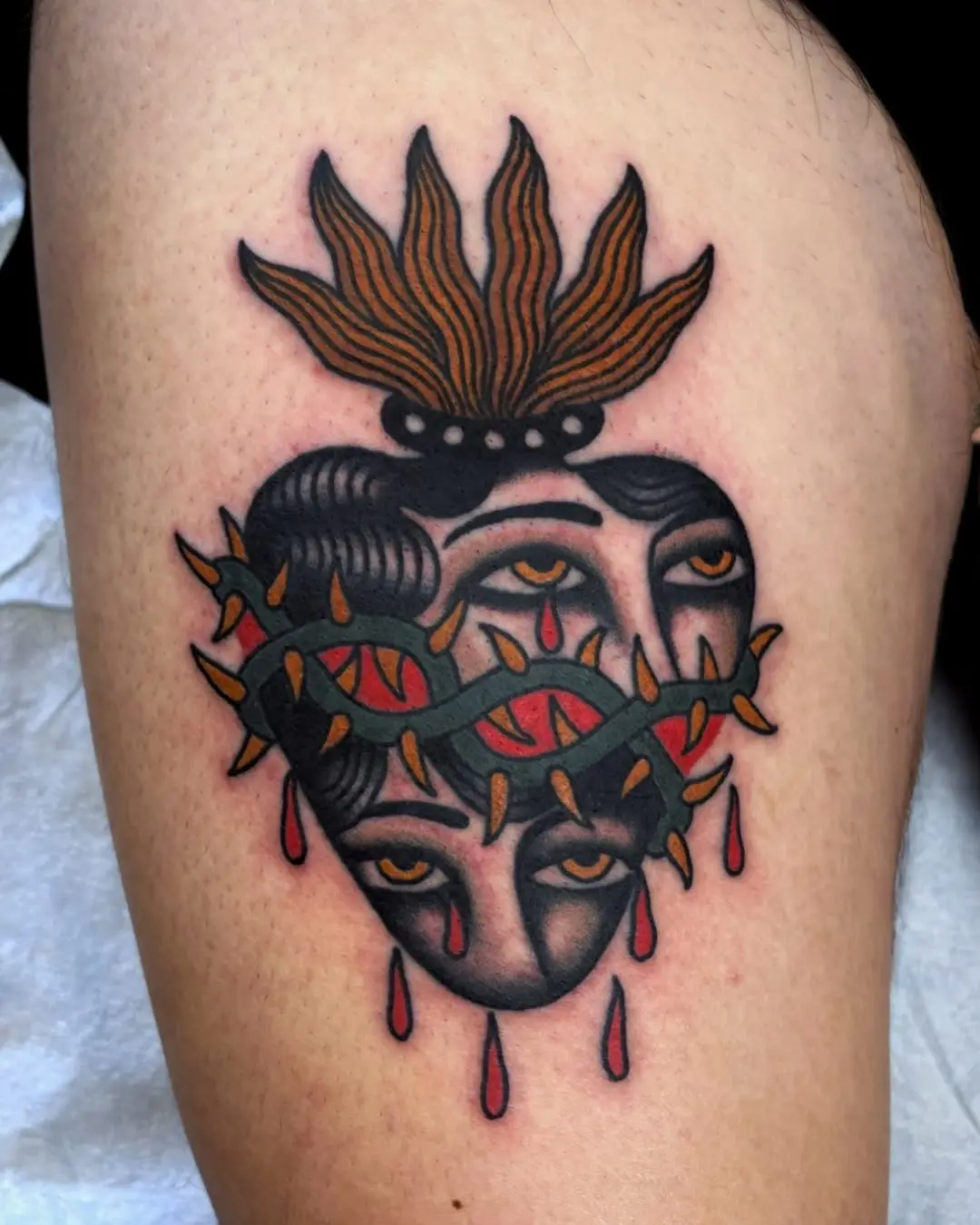 Unique Heart Tattoo with Dual Faces and Thorns