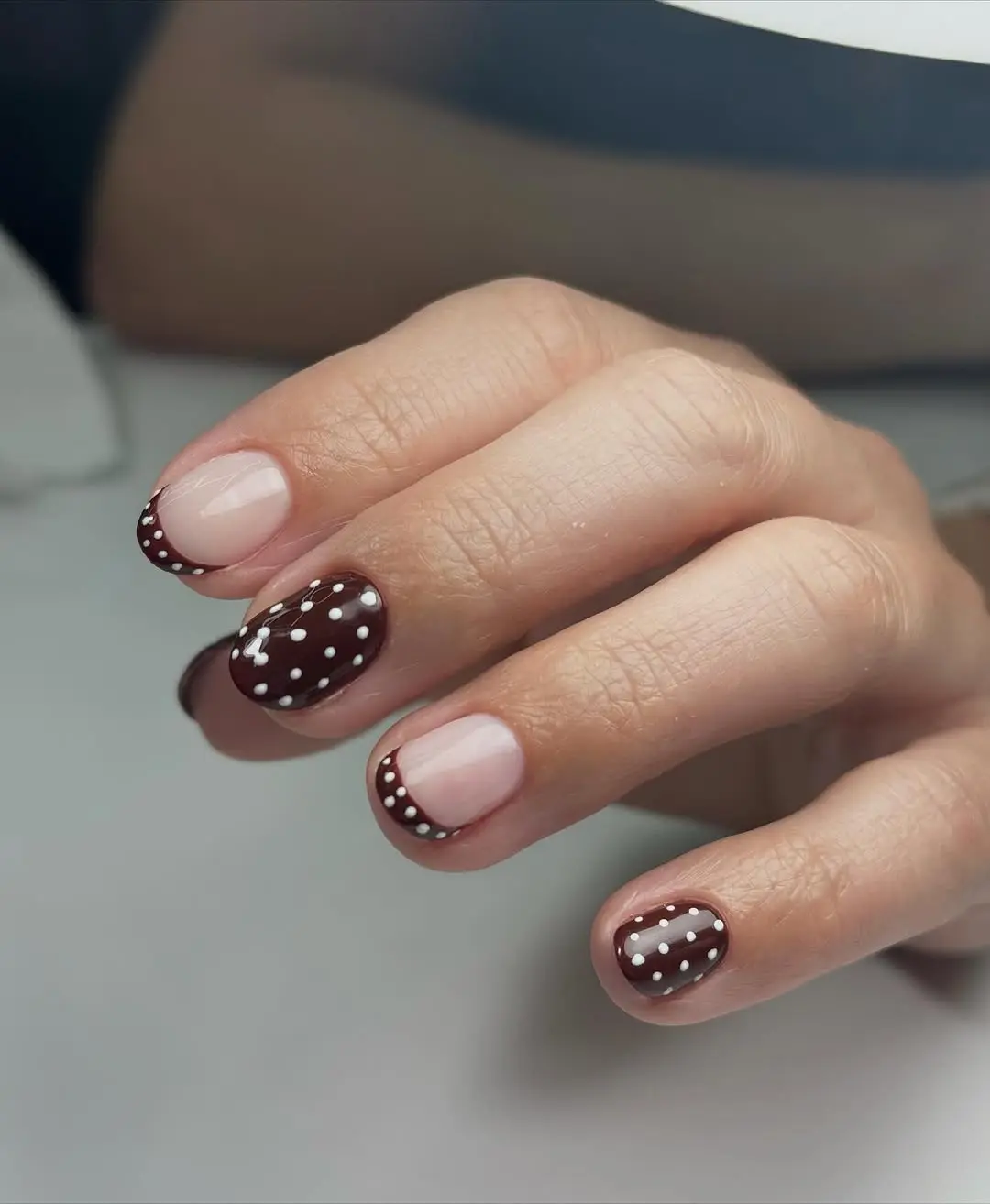 Chic winter nails with playful polka dots