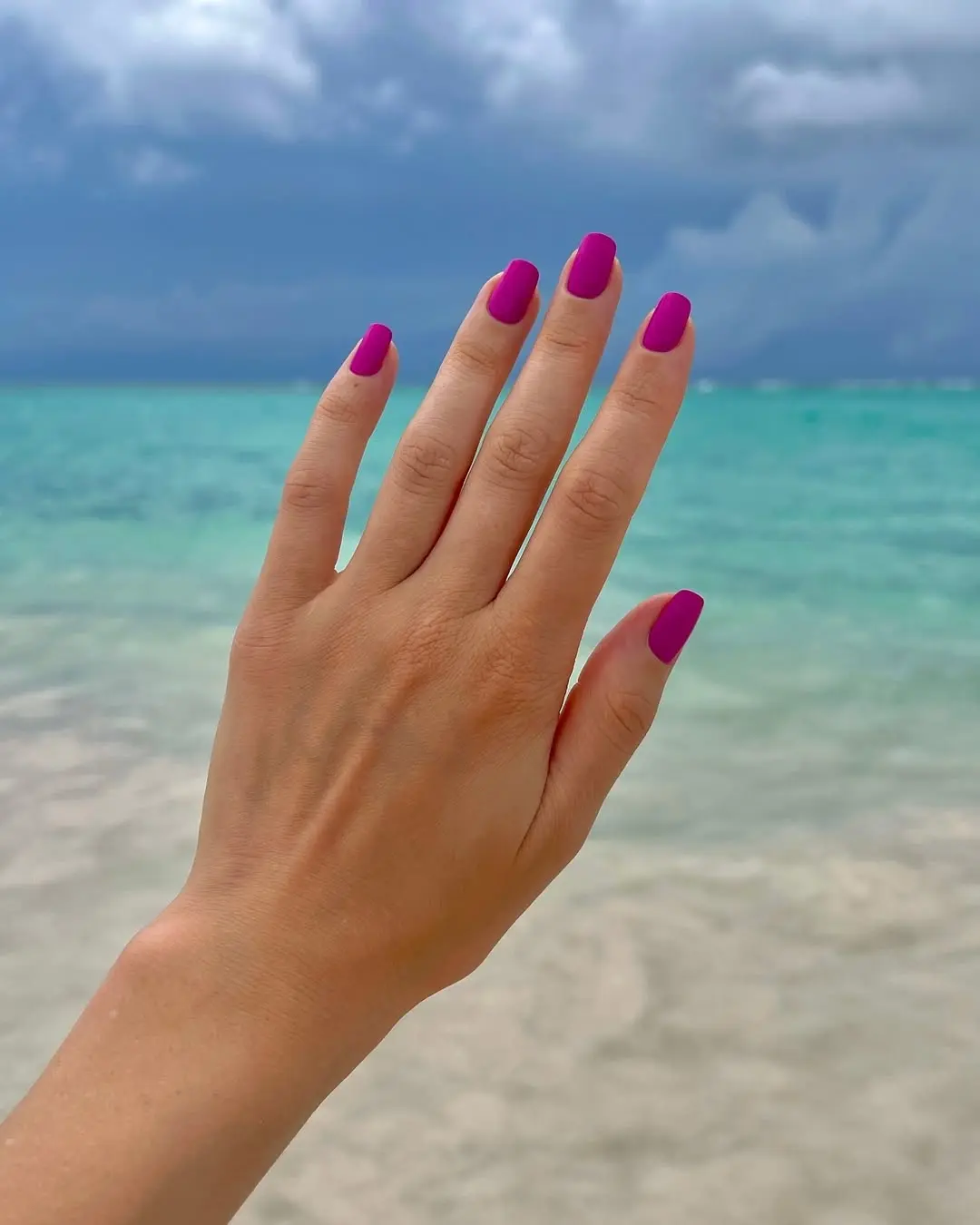 Bright purple nails for beach vibes