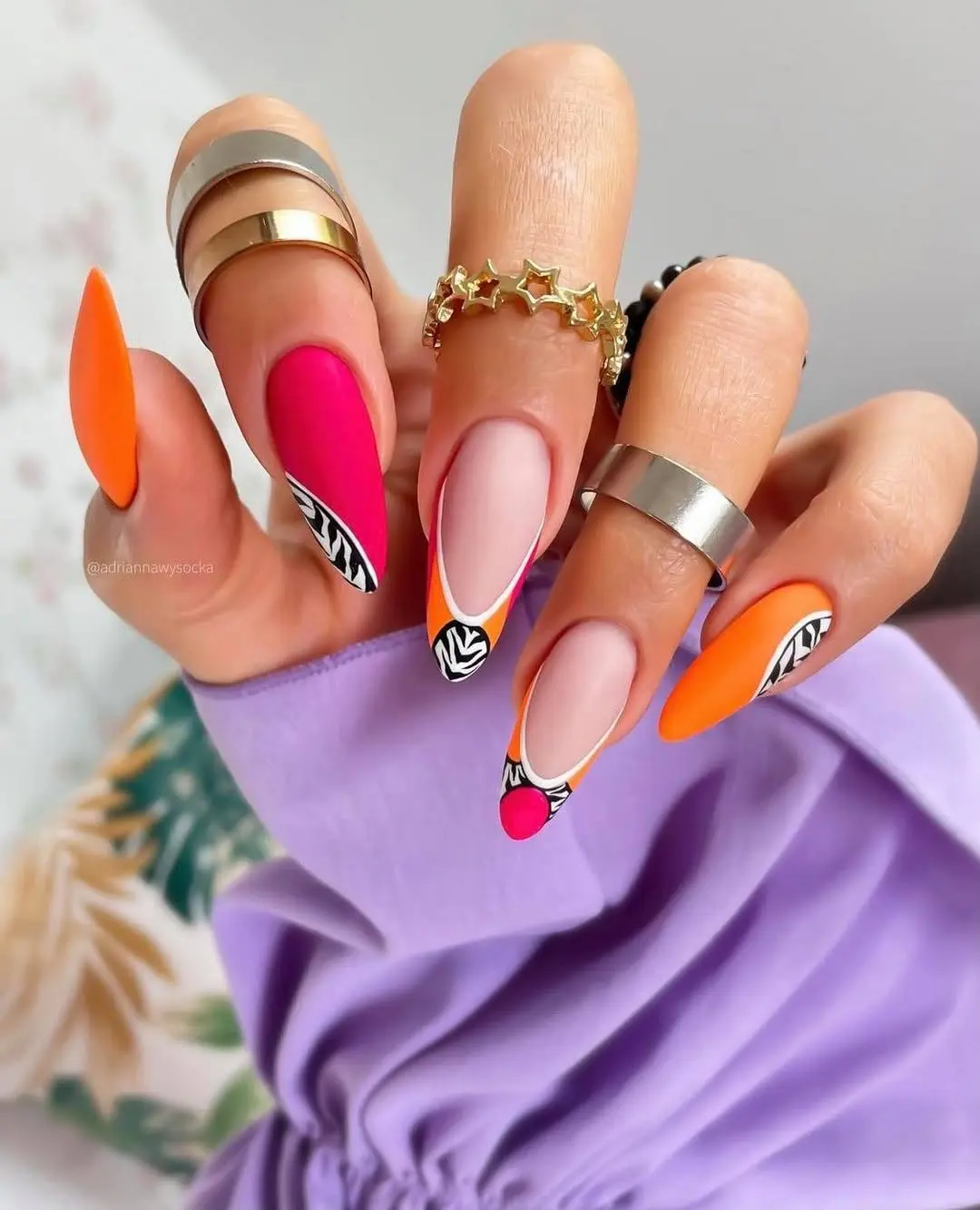 Bold neon nails with unique patterns shine bright