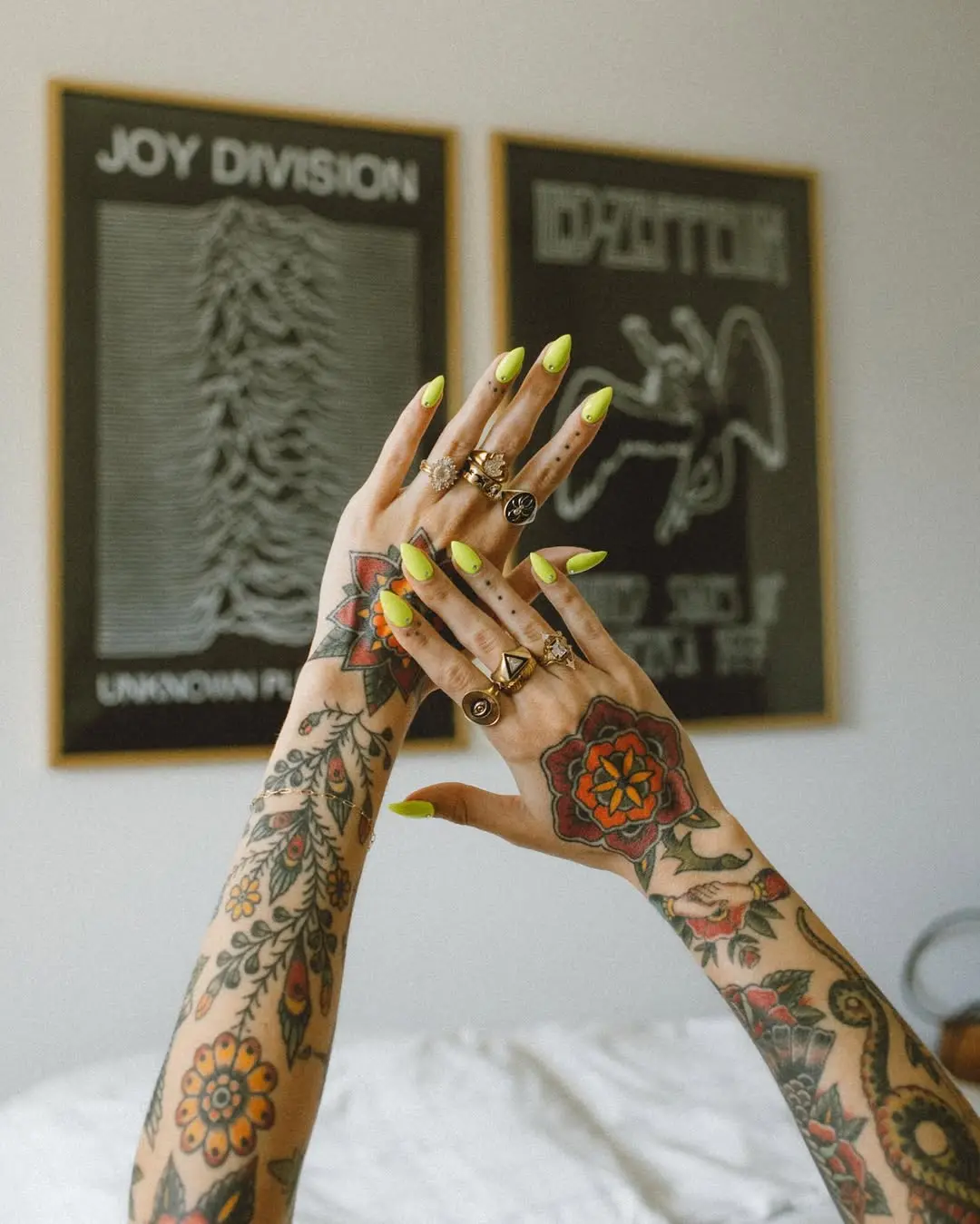 Vivid neon nails with artistic tattoos