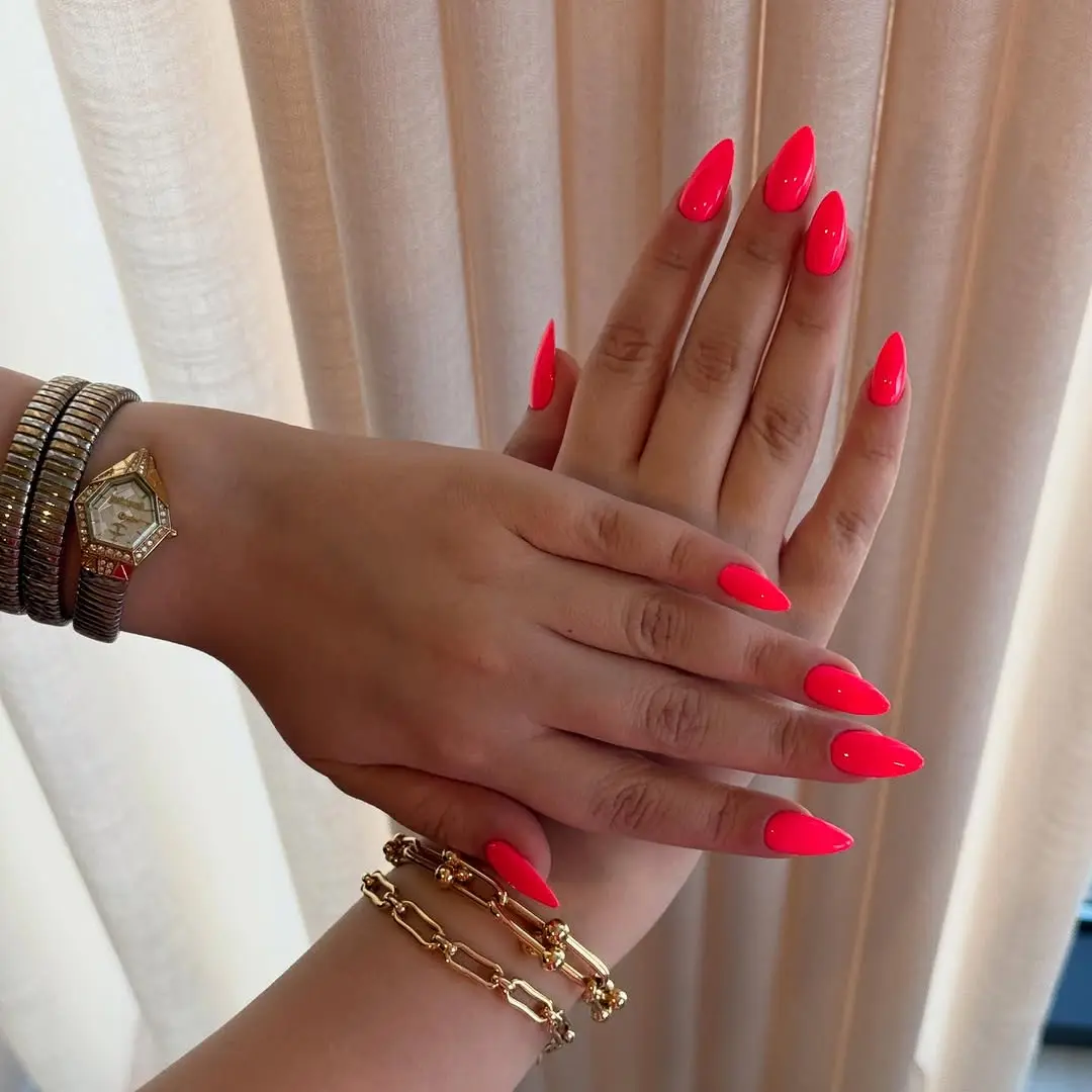 Stylish pink neon almond-shaped nails