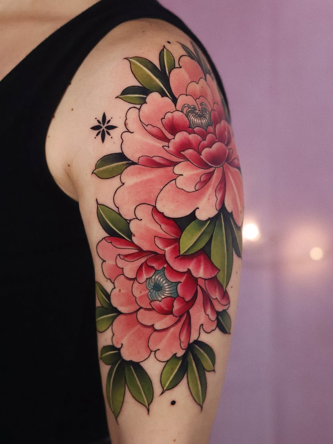 Stunning peony tattoo design on arm