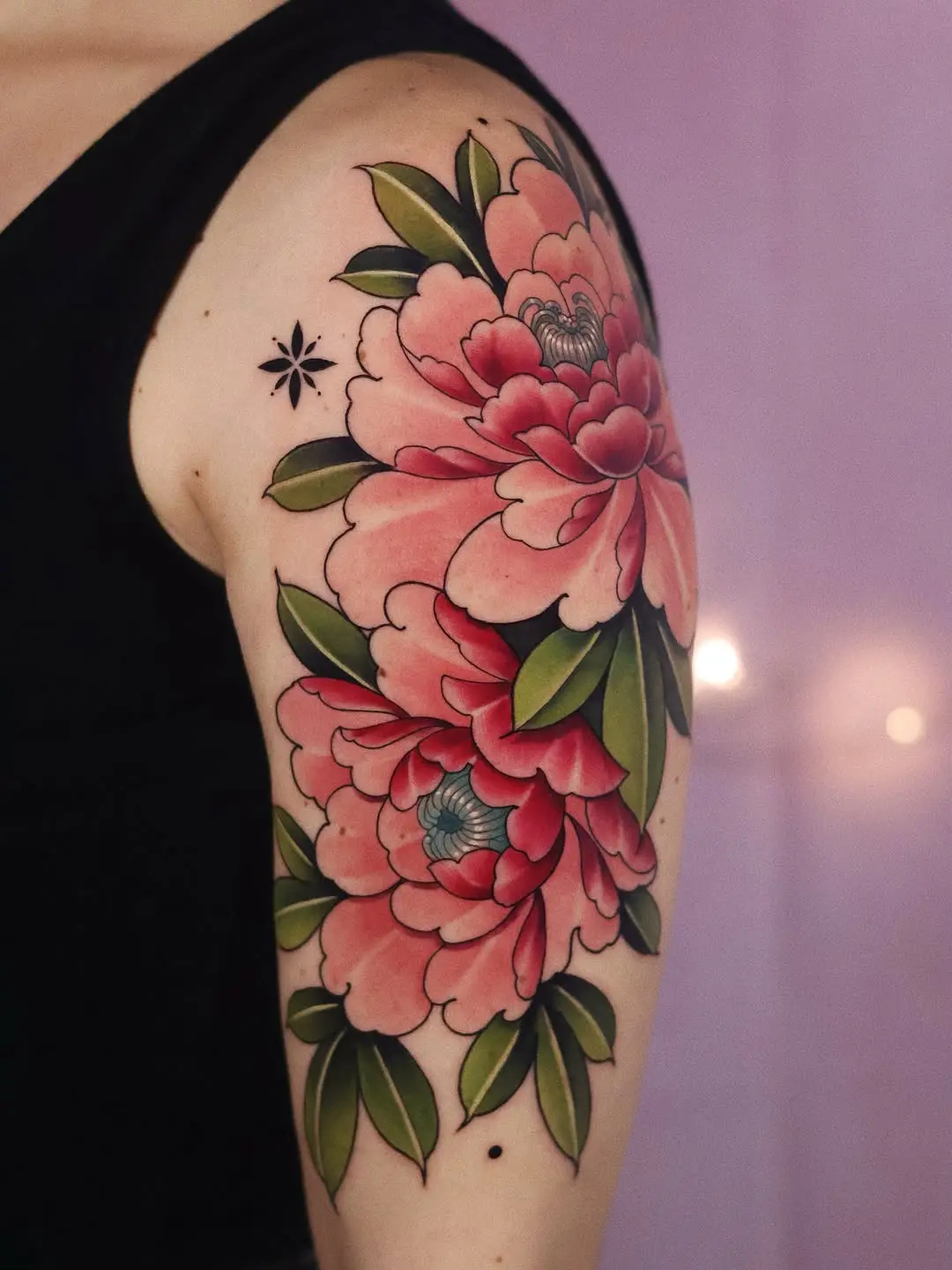 Stunning peony tattoo design on arm